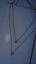 Gold double cross necklace